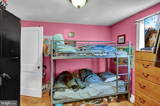 bedroom with wood finished floors
