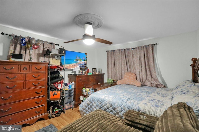 bedroom featuring ceiling fan and wood finished floors