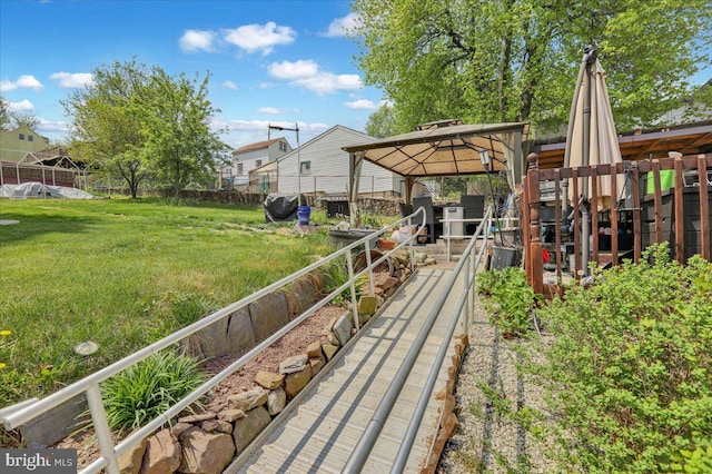 view of yard with a gazebo and fence
