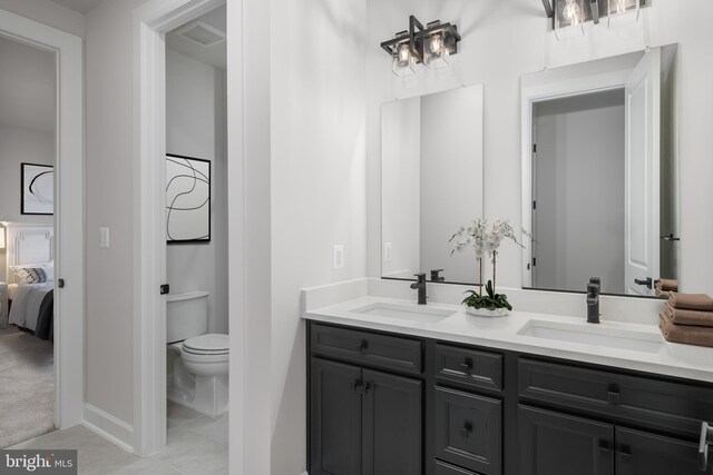 1219 Bear Branch Rd, Laurel, MD 20708 - bathroom with a sink, tile patterned floors, toilet, and double vanity