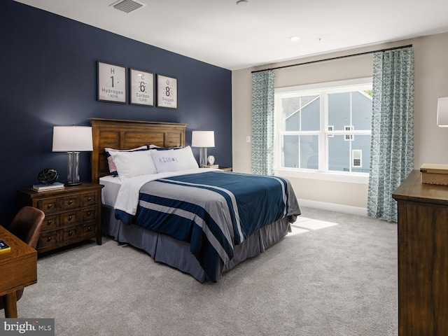 bedroom featuring baseboards, carpet, and visible vents