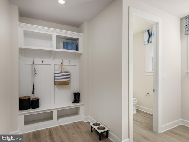 mudroom with baseboards, recessed lighting, and wood finished floors