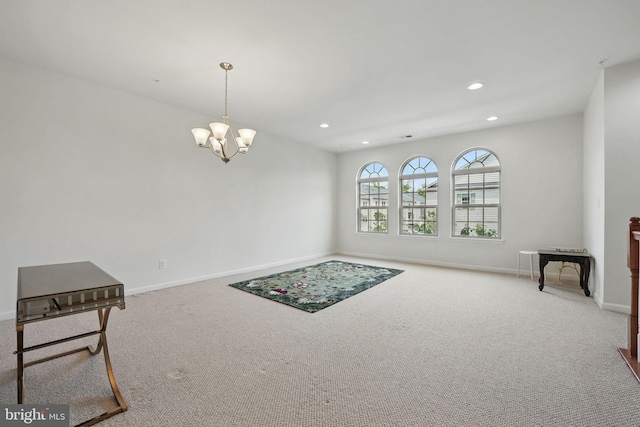 interior space with an inviting chandelier, recessed lighting, baseboards, and carpet flooring