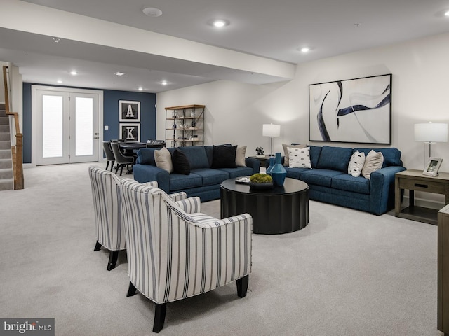 living room with recessed lighting, carpet flooring, and stairs