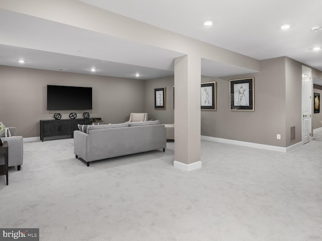 living area featuring recessed lighting, baseboards, visible vents, and light carpet