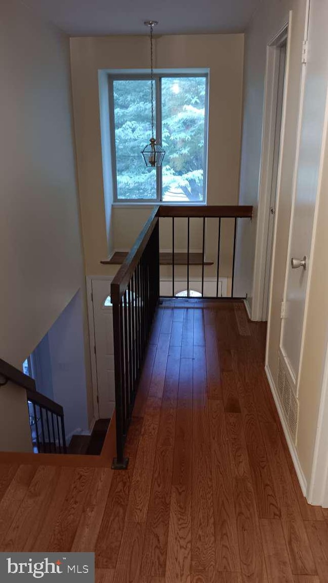 6010 Timber Hollow Ln, Springfield, VA 22152 - interior space with wood finished floors and an upstairs landing