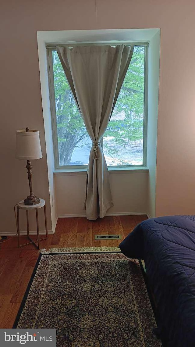 6010 Timber Hollow Ln, Springfield, VA 22152 - bedroom with baseboards, visible vents, and wood finished floors