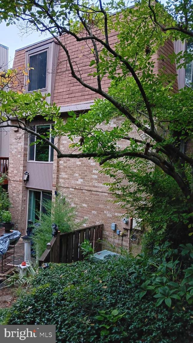 6010 Timber Hollow Ln, Springfield, VA 22152 - view of property exterior with brick siding and mansard roof