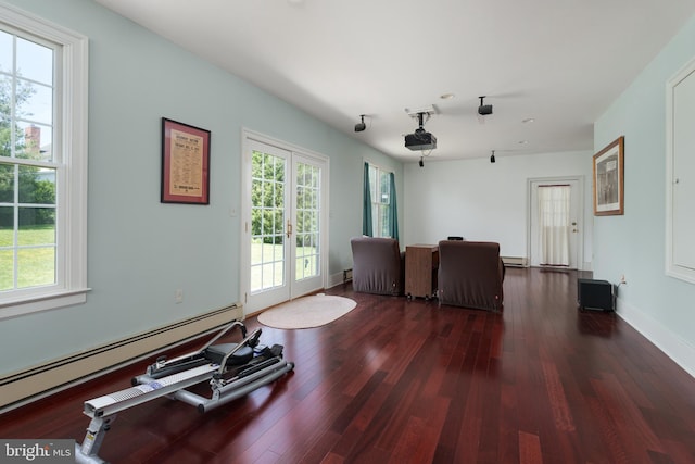 77 N Main St, Cranbury, NJ 08512 - living area with a baseboard heating unit, wood finished floors, french doors, and baseboards