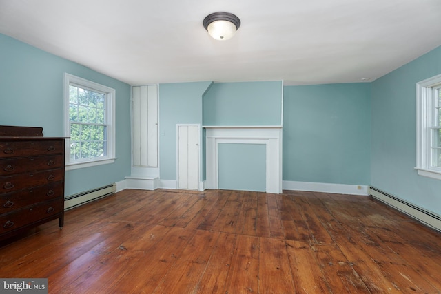 77 N Main St, Cranbury, NJ 08512 - unfurnished living room with baseboard heating, hardwood / wood-style flooring, and baseboards