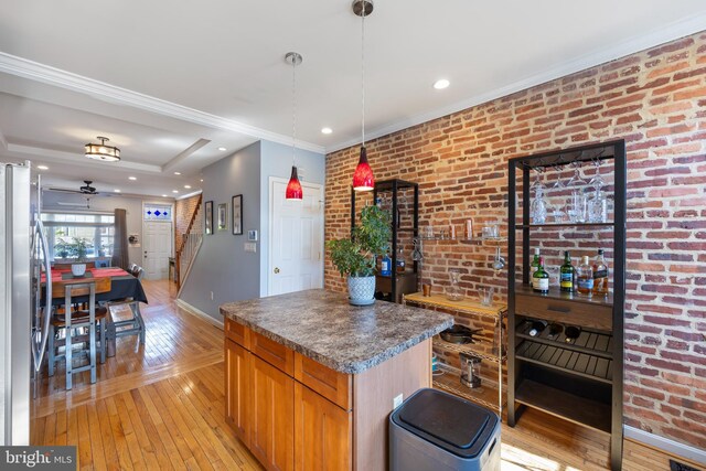 250 S Bouldin St, Baltimore, MD 21224 - kitchen with dark countertops, freestanding refrigerator, a ceiling fan, baseboards, and light wood-type flooring