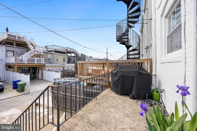 250 S Bouldin St, Baltimore, MD 21224 - view of patio featuring fence, a grill, stairway, and a residential view