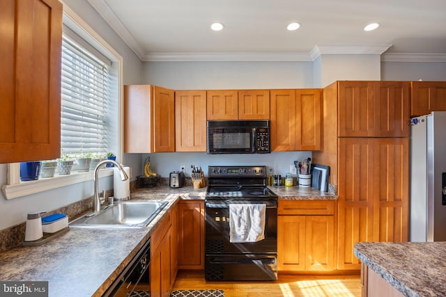 250 S Bouldin St, Baltimore, MD 21224 - kitchen featuring crown molding, a sink, brown cabinets, and black appliances