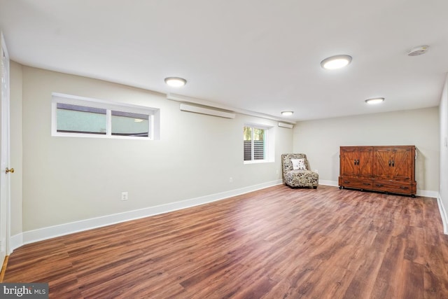 unfurnished room featuring baseboards and wood finished floors