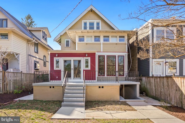 view of front of property featuring french doors and fence private yard