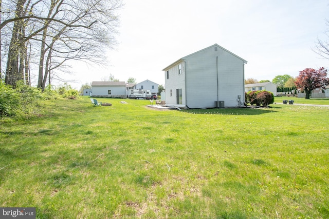view of yard with central AC unit