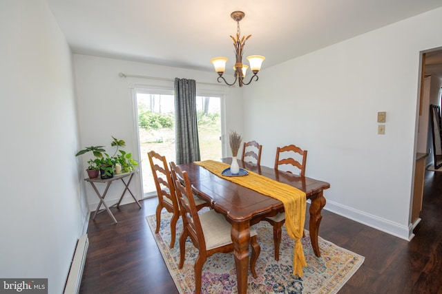 dining room with baseboards, a baseboard heating unit, wood finished floors, and a chandelier