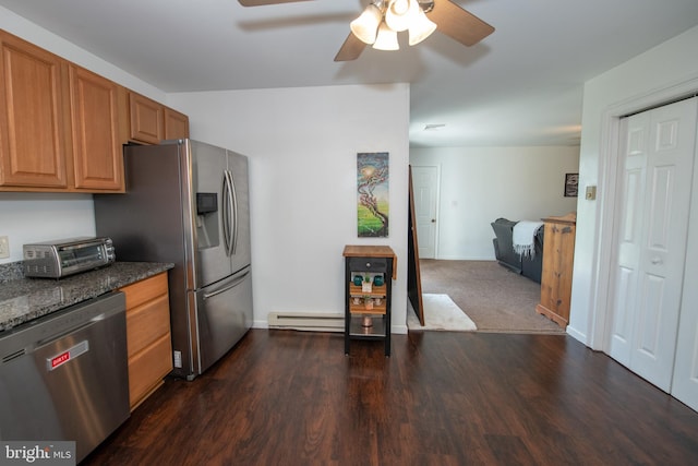 kitchen featuring dark wood-style flooring, appliances with stainless steel finishes, a baseboard radiator, a ceiling fan, and a toaster
