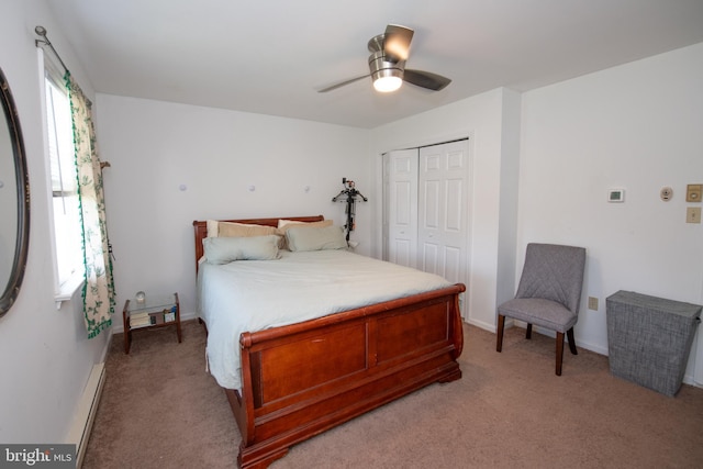 bedroom featuring baseboards, a ceiling fan, a closet, and light colored carpet