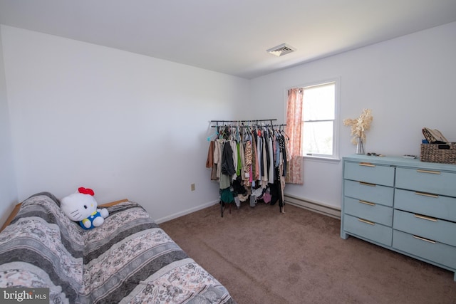 carpeted bedroom with visible vents, a baseboard radiator, and baseboards