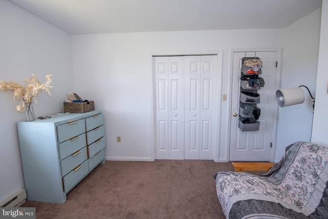 living area with baseboards, carpet, and a baseboard heating unit