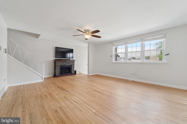 11757 Dimarco Dr, Philadelphia, PA 19154 - unfurnished living room with ceiling fan, light wood finished floors, baseboards, and a fireplace