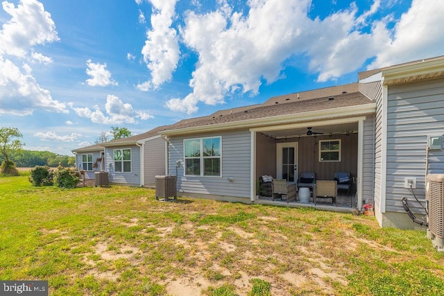 28020 Dew Drop Ln, Millville, DE 19967 - rear view of house featuring a yard, a patio, an outdoor living space, and central air condition unit