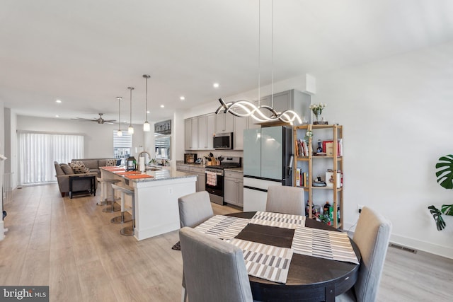 1490 Meadowlark Glen Rd, Dumfries, VA 22026 - dining room with light wood finished floors, recessed lighting, a ceiling fan, and baseboards