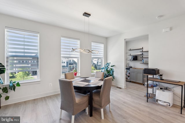 1490 Meadowlark Glen Rd, Dumfries, VA 22026 - dining space with light wood-style floors and baseboards