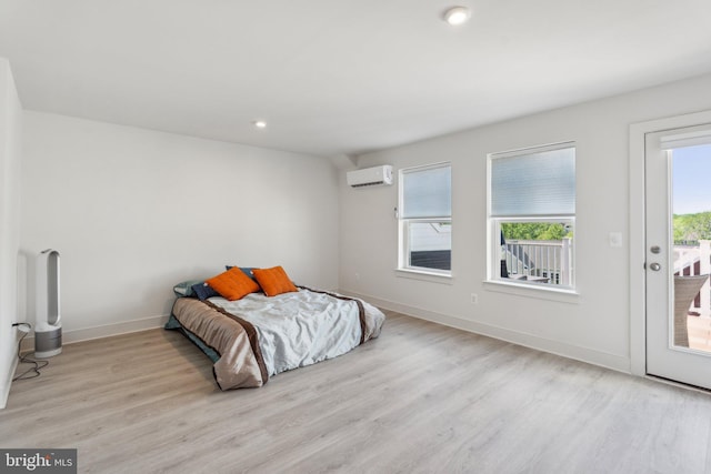 1490 Meadowlark Glen Rd, Dumfries, VA 22026 - bedroom featuring a wall unit AC, access to exterior, wood finished floors, baseboards, and recessed lighting