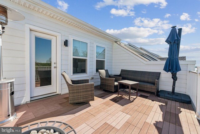 1490 Meadowlark Glen Rd, Dumfries, VA 22026 - wooden deck with an outdoor living space with a fire pit