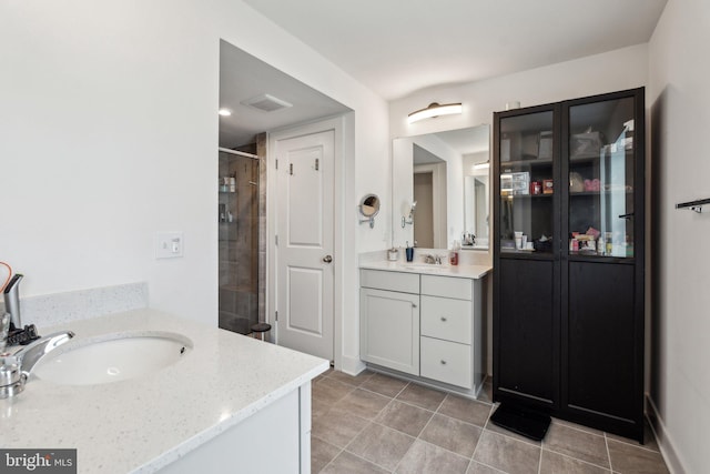 1490 Meadowlark Glen Rd, Dumfries, VA 22026 - full bath with a stall shower, two vanities, and tile patterned flooring
