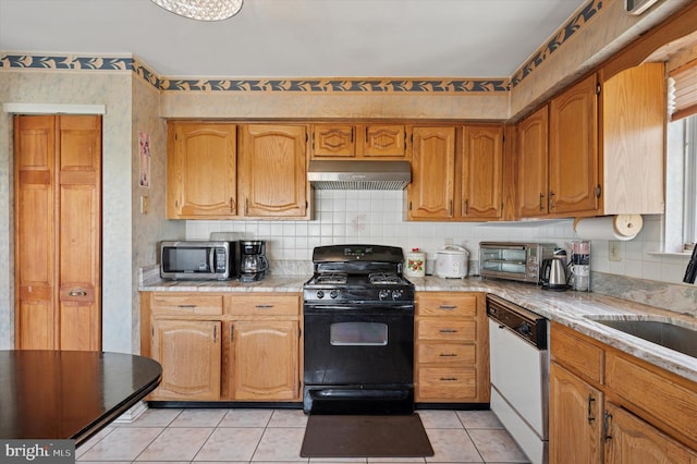 kitchen with black range with gas cooktop, dishwasher, a sink, ventilation hood, and stainless steel microwave