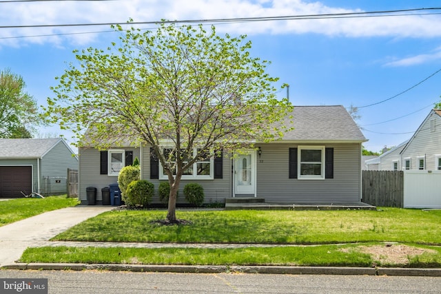 view of front of property with fence and a front yard