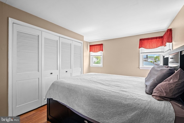 bedroom with a closet and wood finished floors