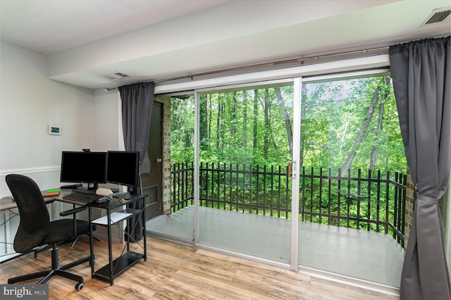 office with visible vents and wood finished floors