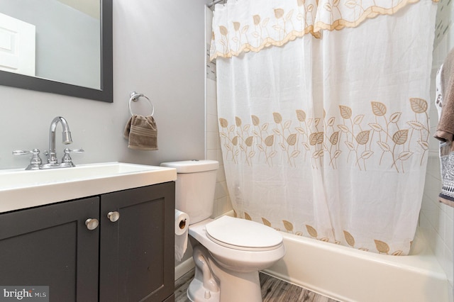 full bathroom featuring vanity, wood finished floors, shower / bath combo, and toilet