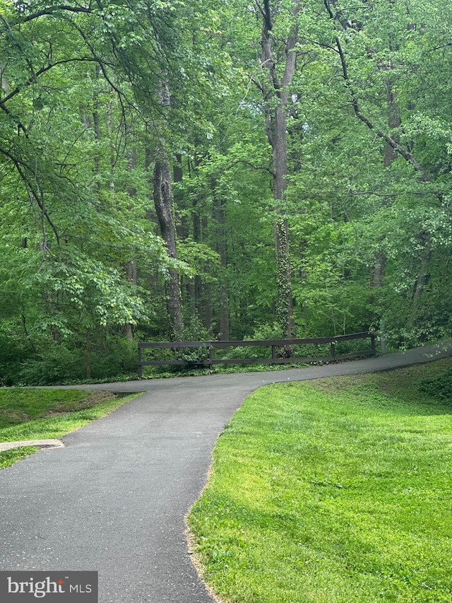 view of street featuring a forest view