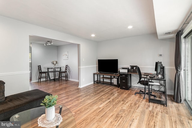 living area with baseboards, recessed lighting, wood finished floors, and visible vents