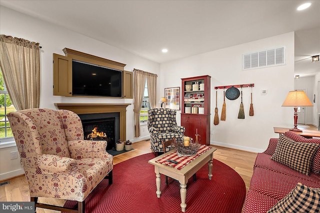 38284 Clearwater Ct, Ocean View, DE 19970 - living area featuring visible vents, light wood-style flooring, a fireplace with flush hearth, and recessed lighting