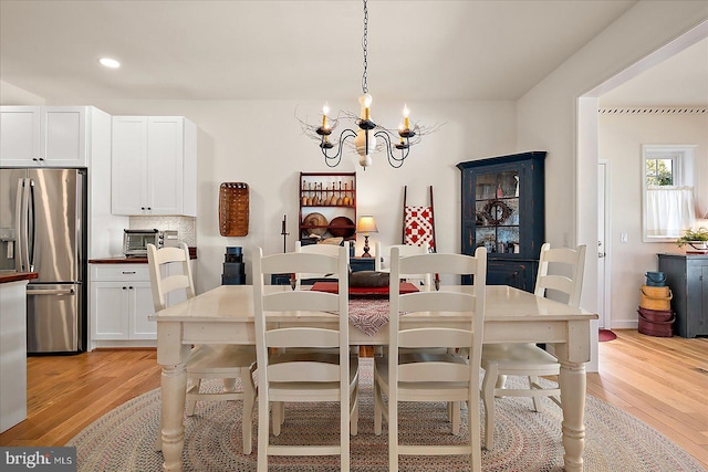38284 Clearwater Ct, Ocean View, DE 19970 - dining room featuring an inviting chandelier, light wood-type flooring, and recessed lighting