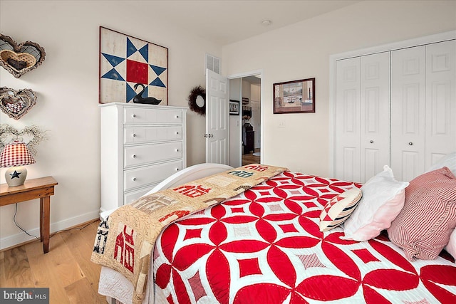 38284 Clearwater Ct, Ocean View, DE 19970 - bedroom featuring a closet, baseboards, visible vents, and light wood-style floors