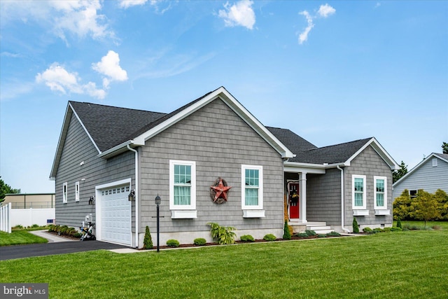 38284 Clearwater Ct, Ocean View, DE 19970 - view of front facade featuring driveway, fence, a garage, a shingled roof, and a front lawn