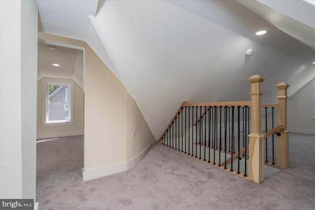 additional living space featuring recessed lighting, carpet flooring, baseboards, and lofted ceiling