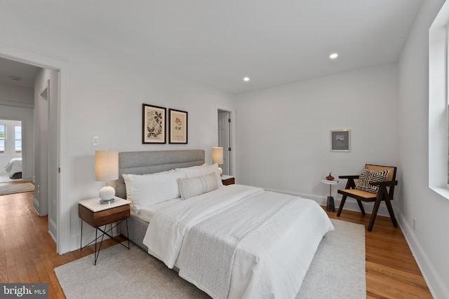 bedroom featuring recessed lighting, baseboards, and wood finished floors