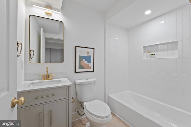 full bath with vanity, baseboards, and toilet