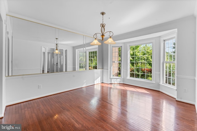 601 James Ridge Rd, Bowie, MD 20721 - unfurnished dining area featuring hardwood / wood-style floors and baseboards
