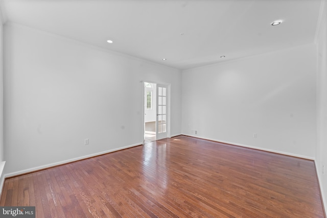 601 James Ridge Rd, Bowie, MD 20721 - spare room featuring crown molding, hardwood / wood-style flooring, baseboards, and recessed lighting
