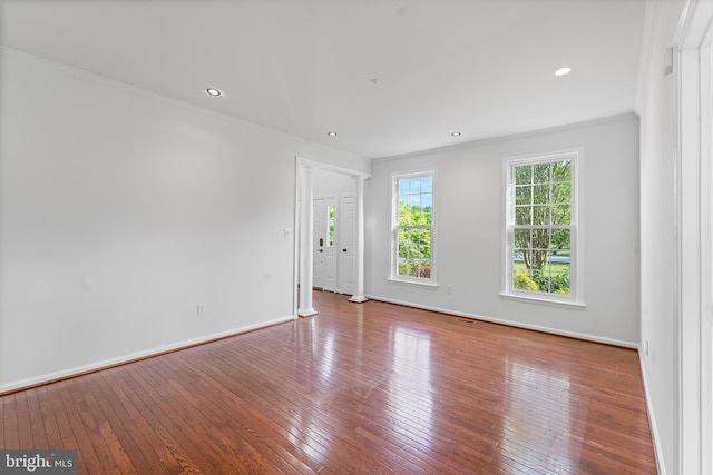 601 James Ridge Rd, Bowie, MD 20721 - spare room featuring wood-type flooring, baseboards, ornamental molding, and recessed lighting