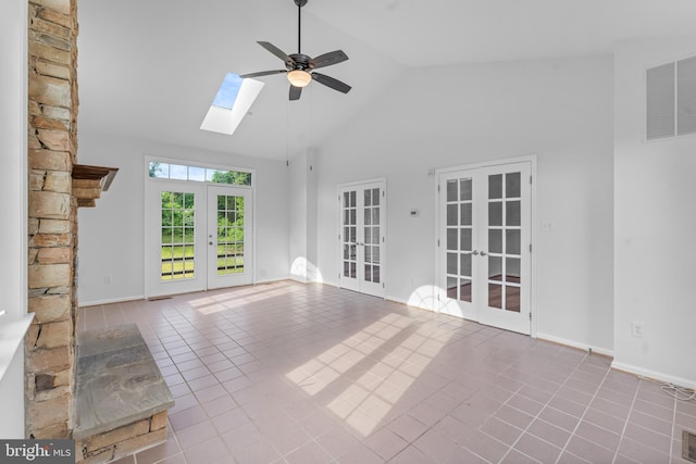 601 James Ridge Rd, Bowie, MD 20721 - unfurnished living room with french doors, ceiling fan, a skylight, high vaulted ceiling, and tile patterned flooring